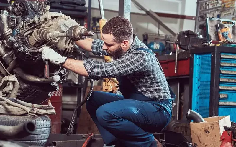 brutal-tattooed-mechanic-repairs-the-car-engine-in-small-pdwtgchn94zox0l4gh7ycx6rg7f6a81nzuqlixcnm0