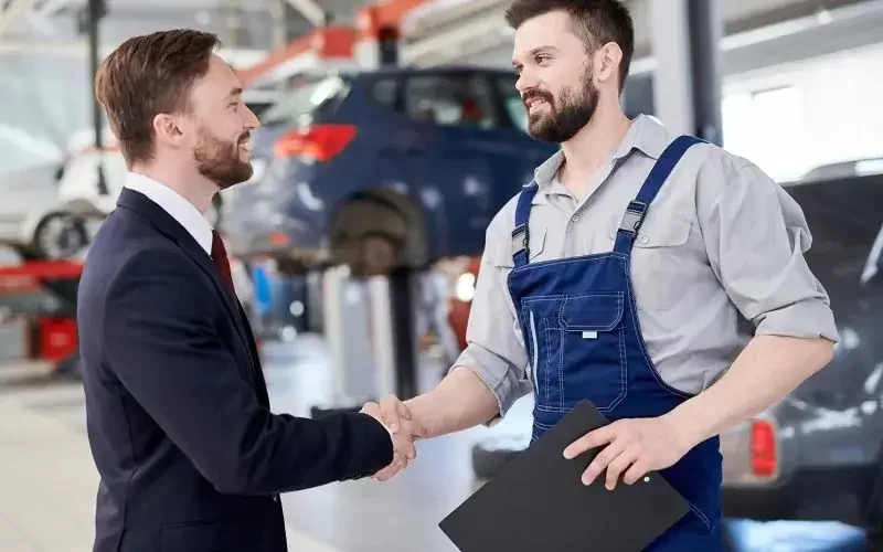 mechanic-shaking-hands-with-businessman-small-pdwtgchn94zox0l4gh7ycx6rg7f6a81nzuqlixcnm0