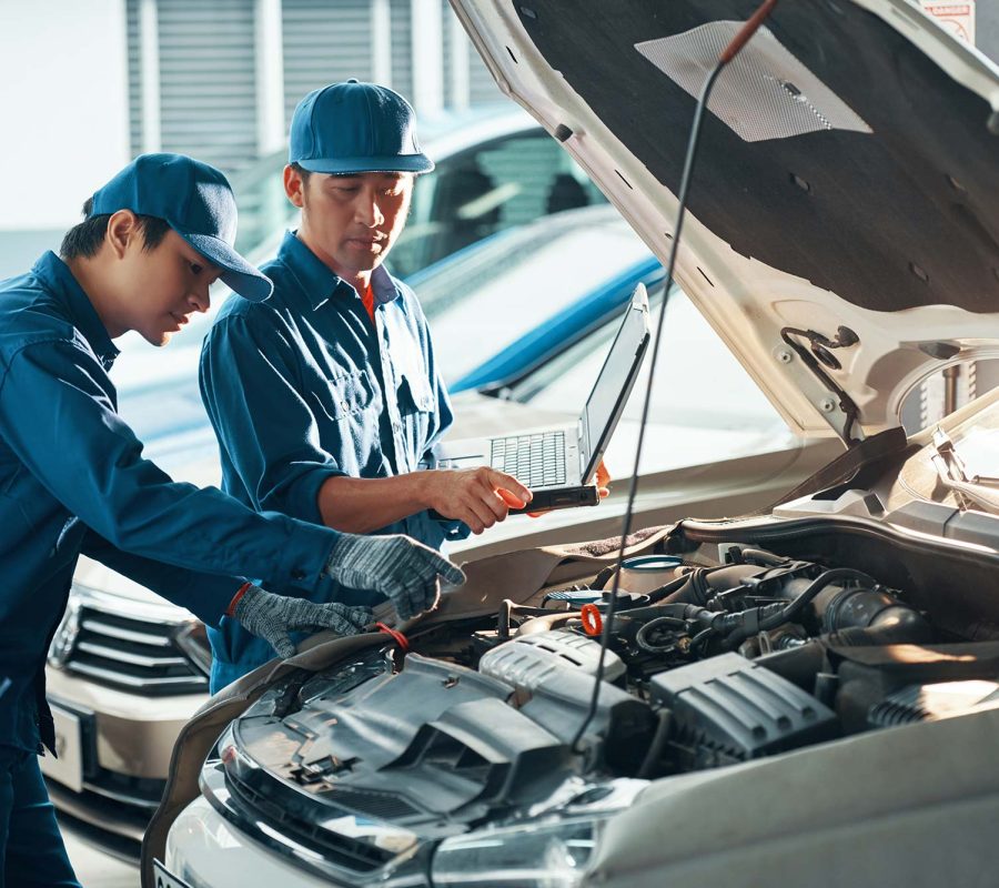 mechanics-inspecting-car-small